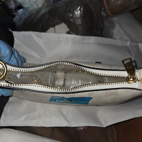 Coach Beige and White Wristlet NWT.